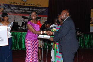 Prof Odai receiving award from the Minister of Environment, Science and Technology,Sherry Aryeetey