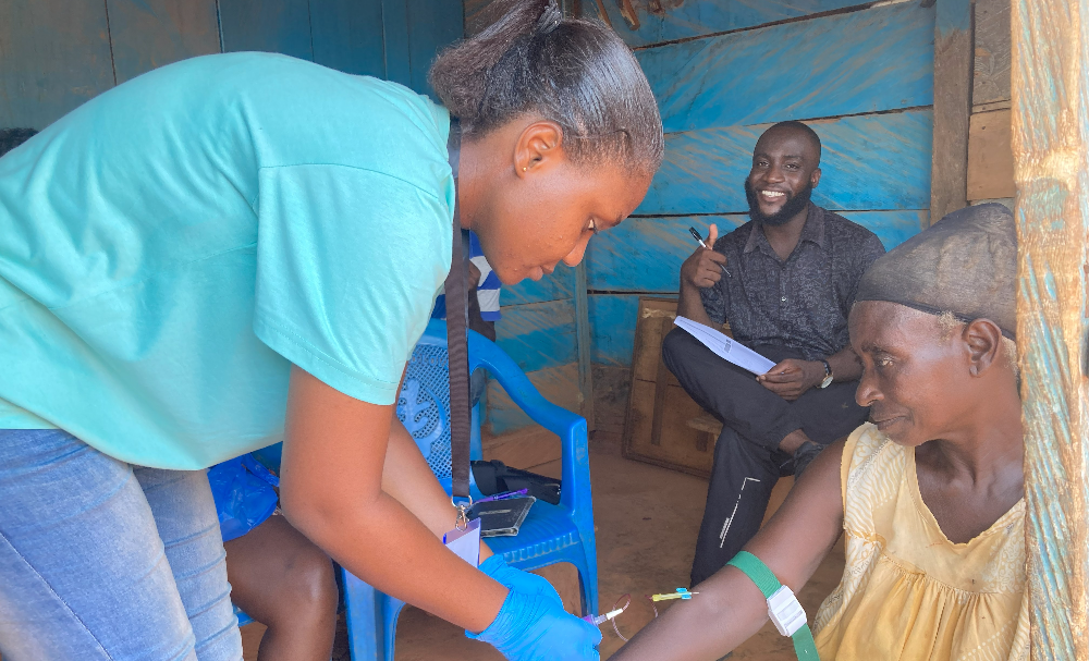 Drawing participant sample during SEROMARV study in the Adansi North District, Ashanti Region, Ghana | Photo credit GHID-KCCR