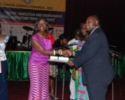 Prof Odai receiving award from the Minister of Environment, Science and Technology,Sherry Aryeetey